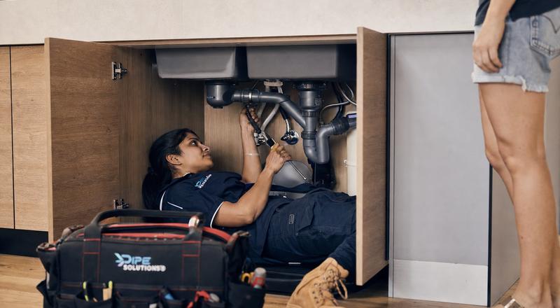 Plumber writing up a job quote
